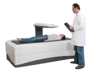 Doctor examining a patient on a medical examination table with a white background